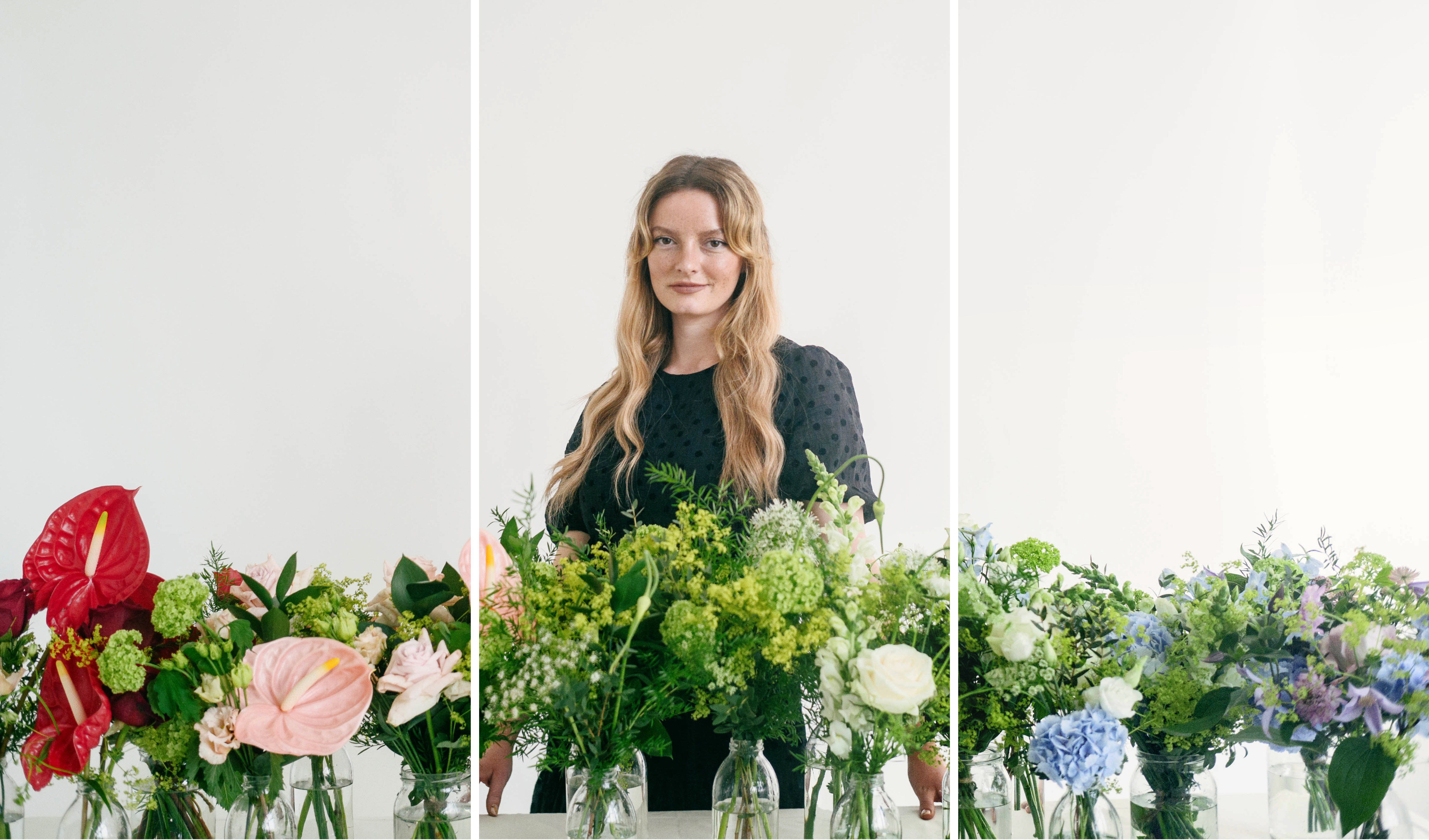 Dakota Blue Richards standing behind a selection of bespoke luxury flowers